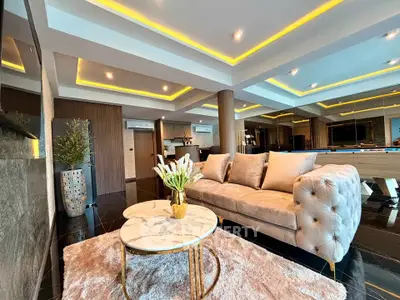 Luxurious modern living room with elegant lighting and plush furniture, perfect for sophisticated urban living.