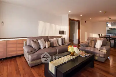 Spacious living room with elegant furniture and hardwood floors