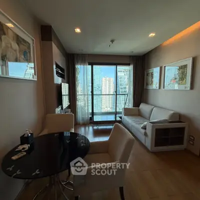 Modern living room with city view, stylish furniture, and elegant decor in high-rise apartment.