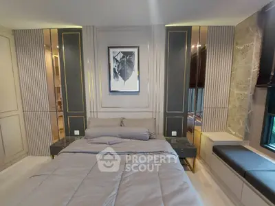 Luxurious bedroom with elegant decor and modern furnishings, featuring a cozy bed and stylish wall art.