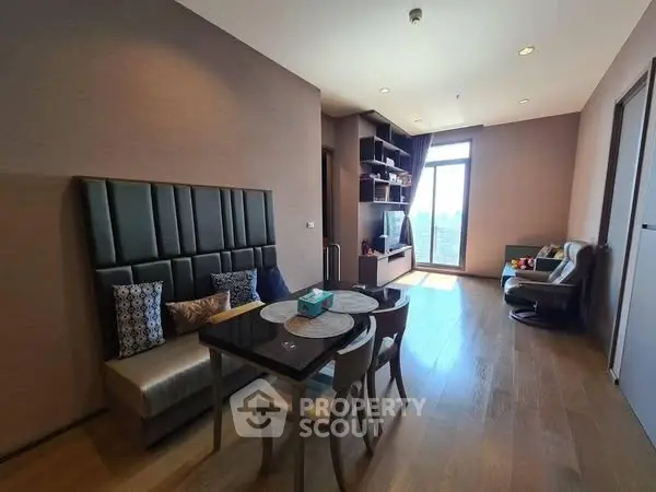 Modern living room with stylish dining area and natural light