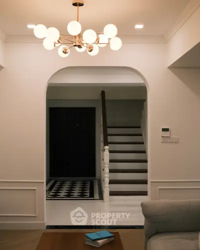 Elegant interior with stylish lighting and staircase in modern home