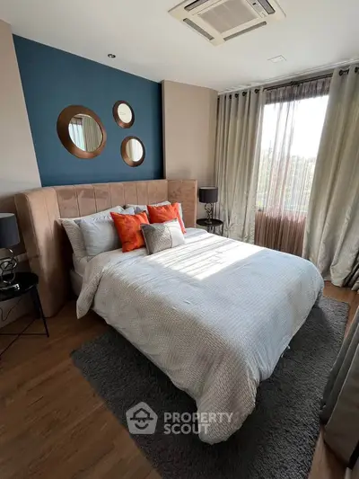 Stylish bedroom with modern decor and natural light