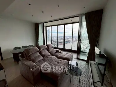 Luxurious living room with panoramic city view and plush seating