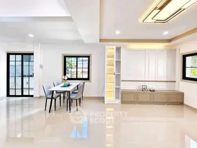 Spacious modern living room with elegant dining area and stylish lighting