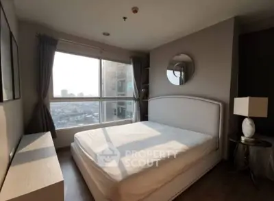 Bright and cozy bedroom with large window offering stunning city views.