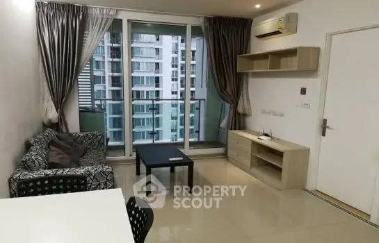 Modern living room with balcony view in high-rise apartment