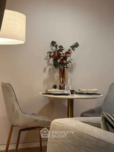 Cozy dining area with elegant table setting and modern decor, perfect for intimate gatherings.