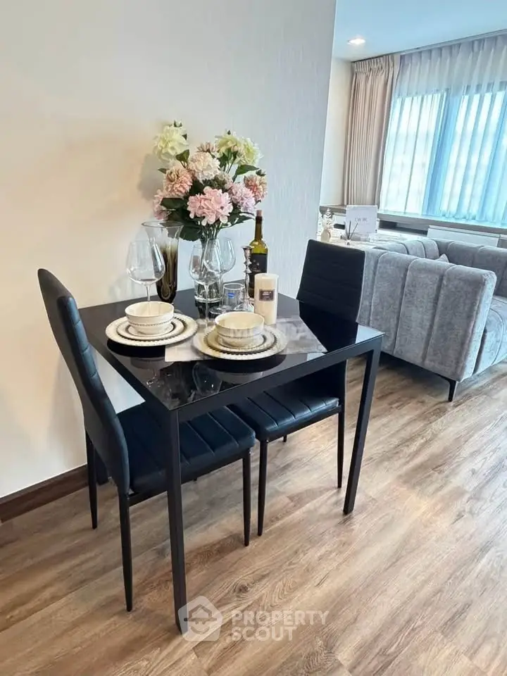 Stylish modern living room with elegant dining area and cozy seating, perfect for urban living.