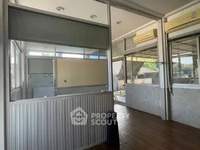 Spacious office space with large windows and air conditioning, ideal for business setup.