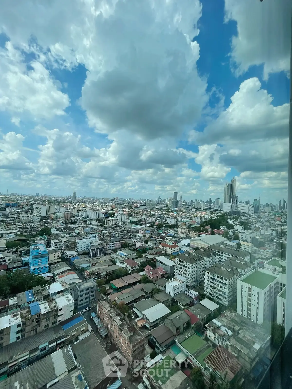 Stunning cityscape view from high-rise building with expansive skyline and vibrant urban landscape.