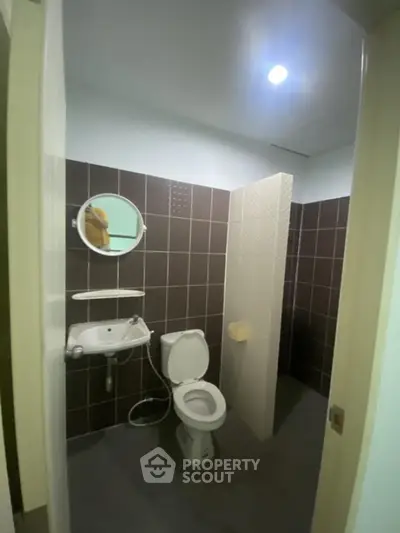 Modern bathroom with sleek design and tiled walls