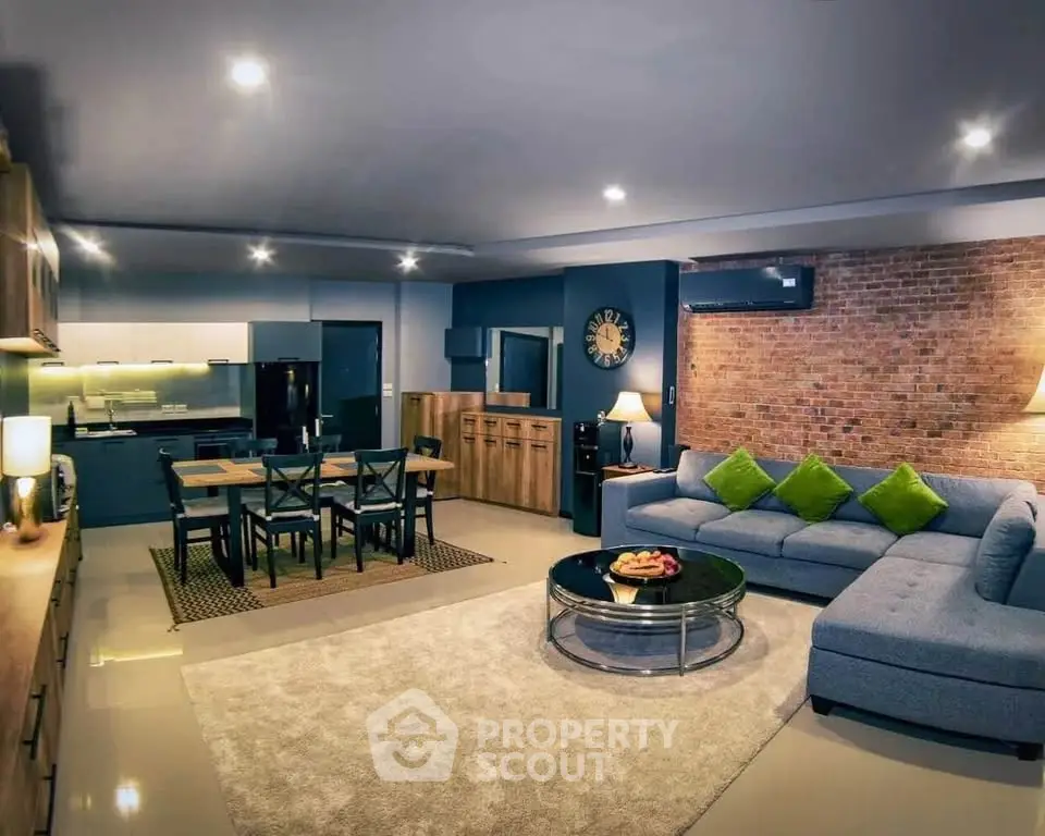 Spacious modern living room with open kitchen and stylish decor