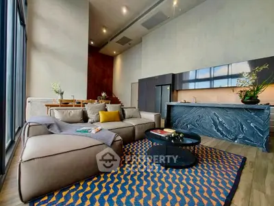 Luxurious modern living room with open kitchen and stylish decor