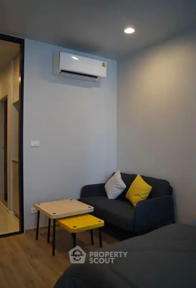 Cozy modern living room with air conditioning and stylish furniture