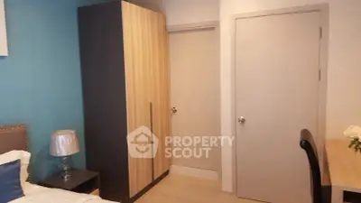 Cozy bedroom with modern wardrobe and stylish decor