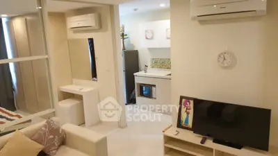 Modern apartment interior with cozy living room and compact kitchen