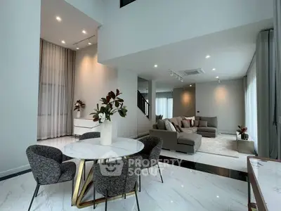 Luxurious modern living room with elegant dining area and stylish decor