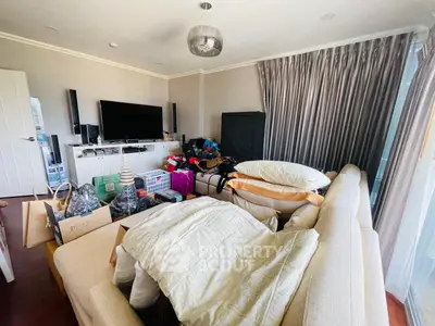 Spacious living room with modern decor and ample natural light