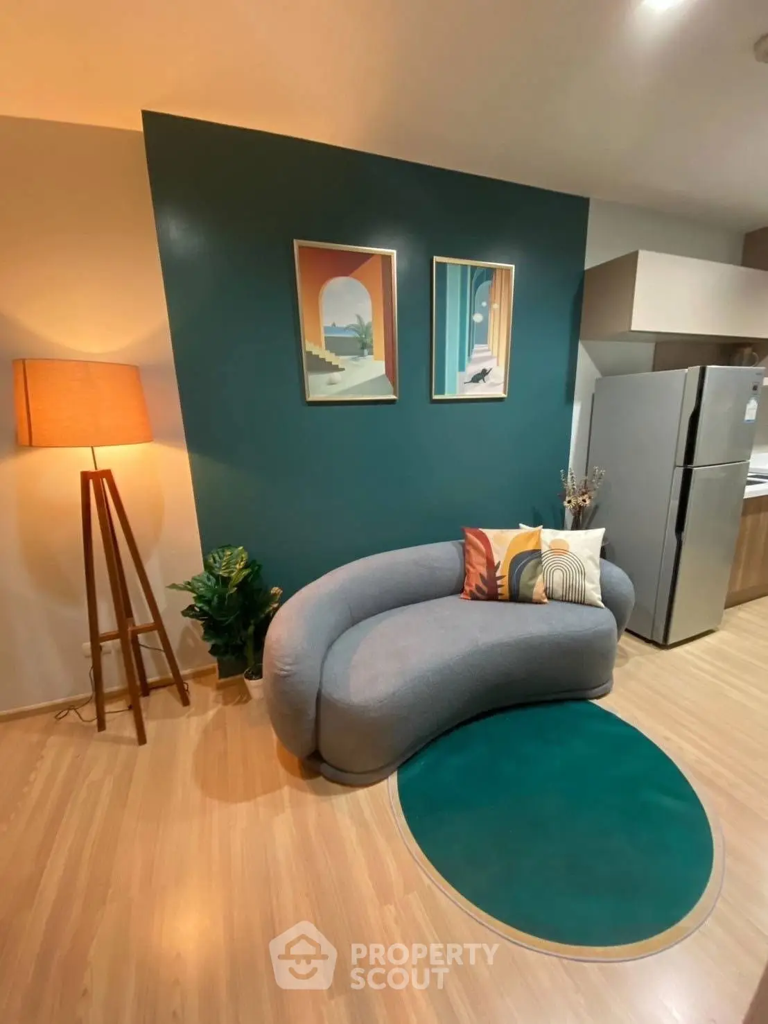 Stylish modern living room with unique curved sofa and vibrant decor