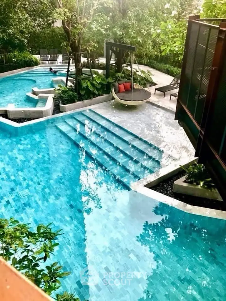 Luxurious outdoor pool area with lush greenery and modern design, perfect for relaxation and leisure.