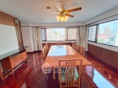Spacious dining room with city views and elegant wooden furniture