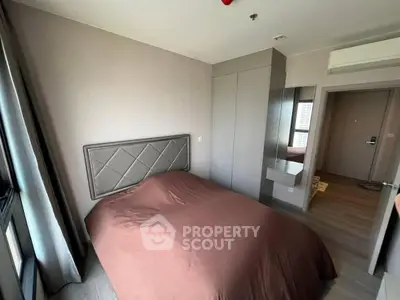 Cozy bedroom with modern design and ample natural light