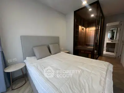 Modern bedroom with stylish decor and spacious walk-in closet