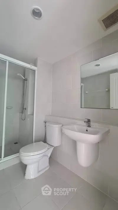 Modern bathroom with sleek shower and contemporary fixtures
