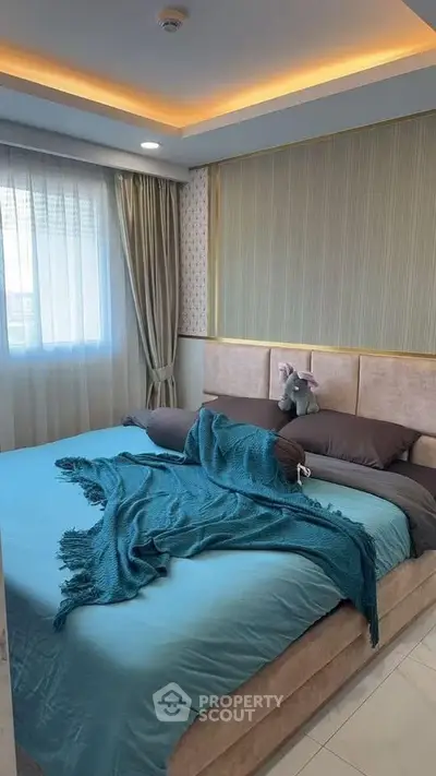 Cozy bedroom with elegant decor and plush bedding, perfect for relaxation and comfort.