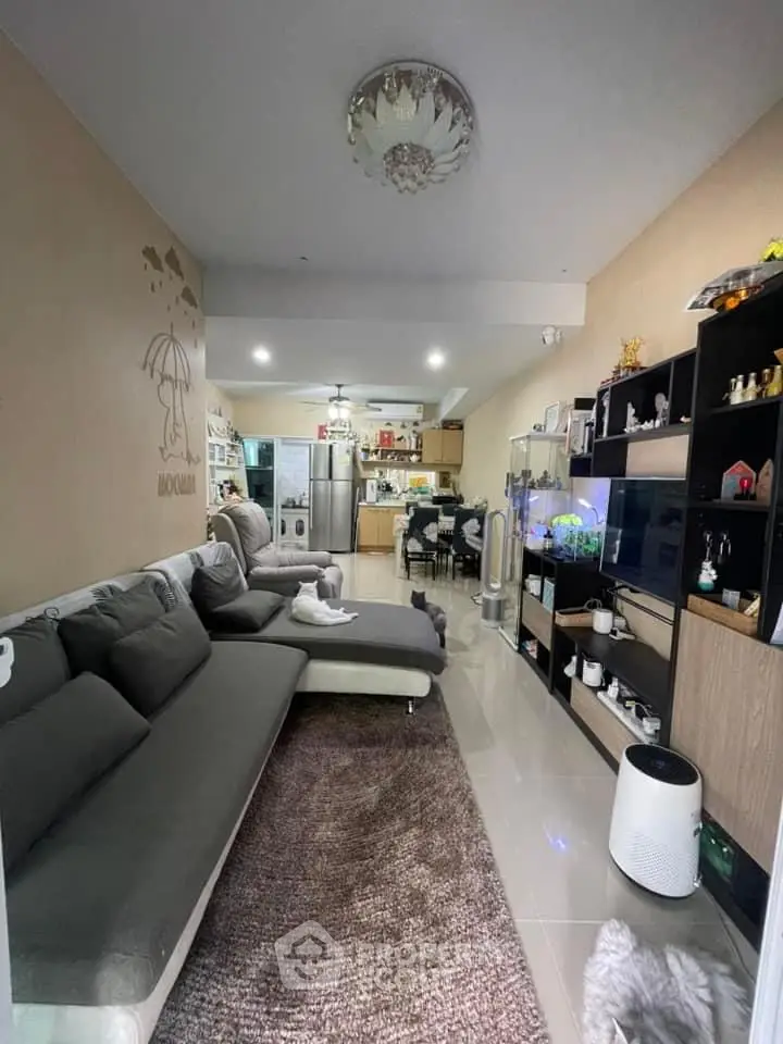 Modern living room with stylish decor and open kitchen layout