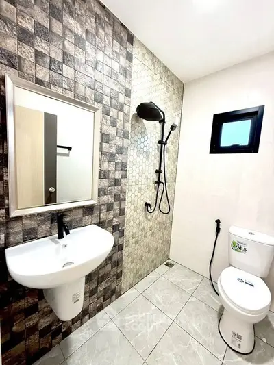 Modern bathroom with stylish tile design and sleek fixtures