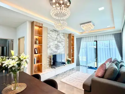 Luxurious modern living room with elegant chandeliers and stylish decor