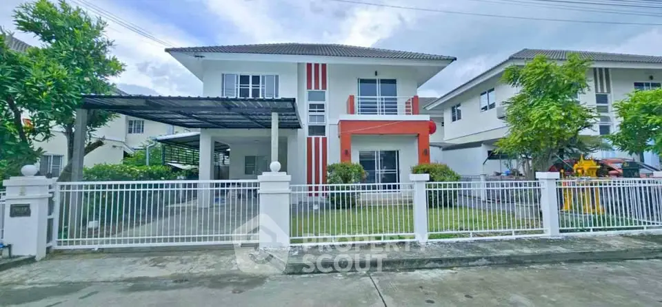 Charming two-story house with modern design and spacious front yard in a serene neighborhood.