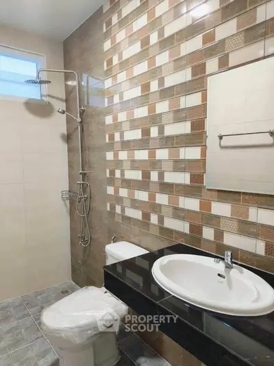 Modern bathroom with stylish tile design and sleek fixtures