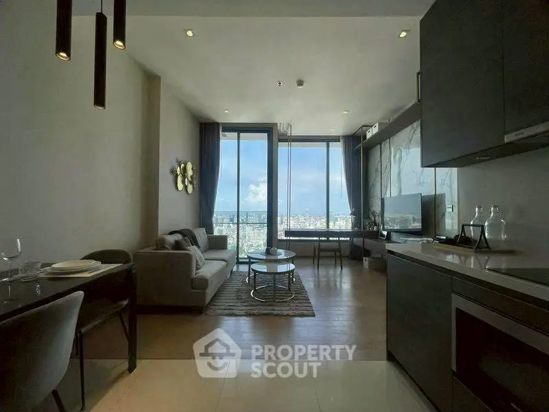 Luxurious modern living room with stunning city view and sleek kitchen design.