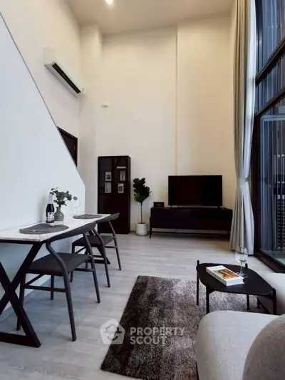 Modern living room with high ceilings and stylish decor
