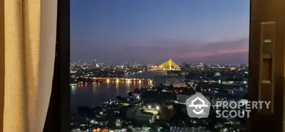 Stunning cityscape view from high-rise apartment window at dusk