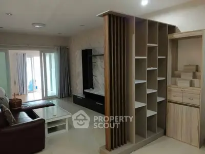 Spacious living room with modern shelving and elegant decor