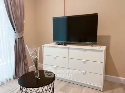 Modern living room with sleek TV setup and elegant decor