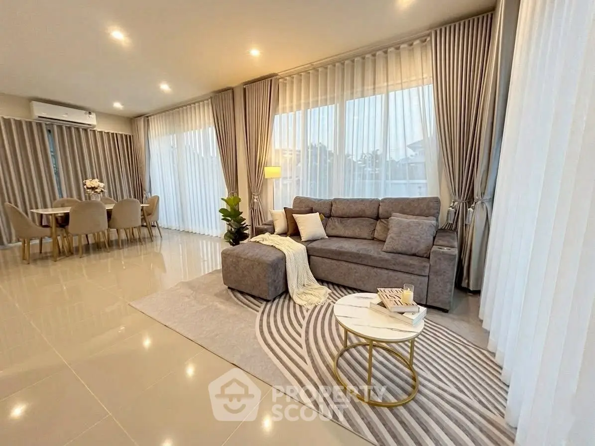 Spacious modern living room with elegant decor and ample natural light