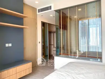 Modern bedroom with stylish wooden accents and large window view