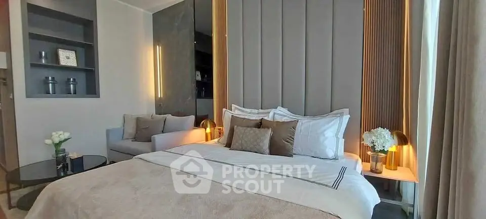 Luxurious bedroom with elegant decor and cozy seating area