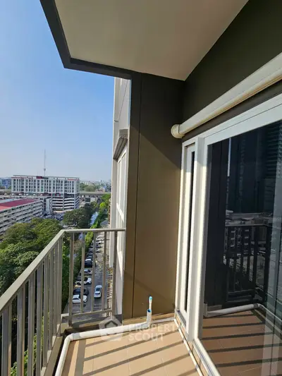 Spacious balcony with stunning city view in modern high-rise apartment