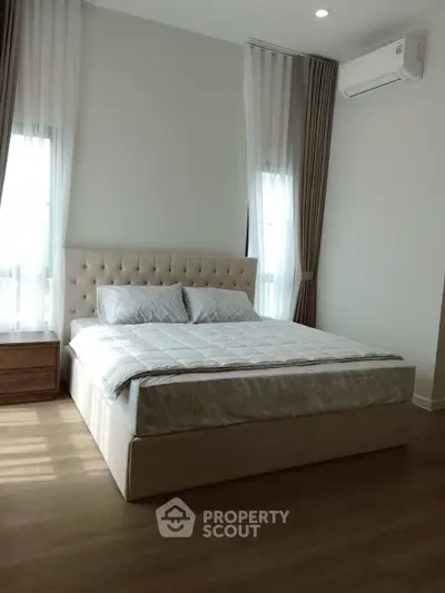 Elegant bedroom with natural light and modern furnishings