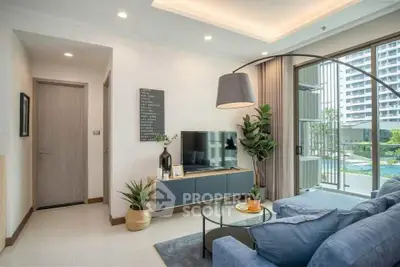 Modern living room with stylish decor and pool view, perfect for relaxation.