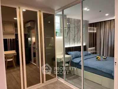 Modern bedroom with mirrored closet and stylish decor