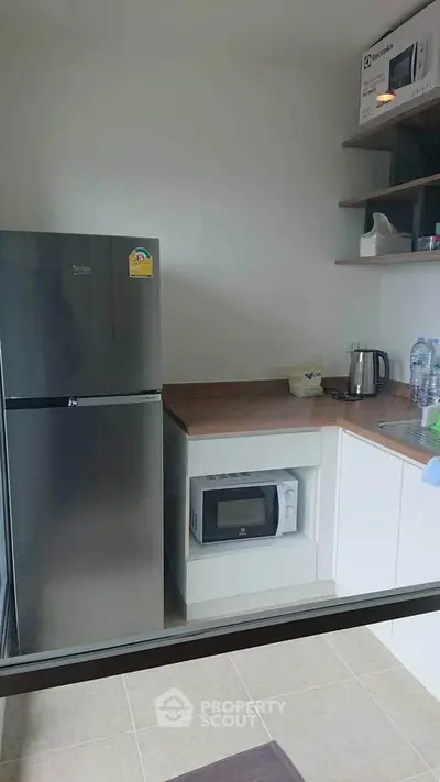 Modern kitchen with sleek appliances and compact design