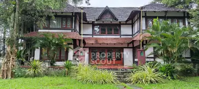 Charming rustic house with lush greenery and traditional architecture, perfect for nature lovers seeking tranquility.