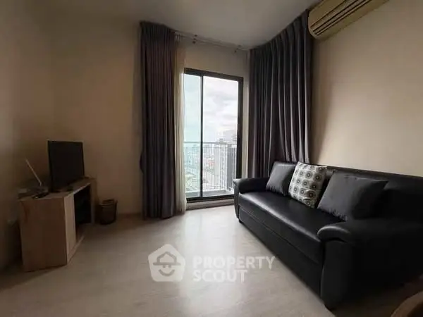 Cozy living room with balcony view and modern furnishings